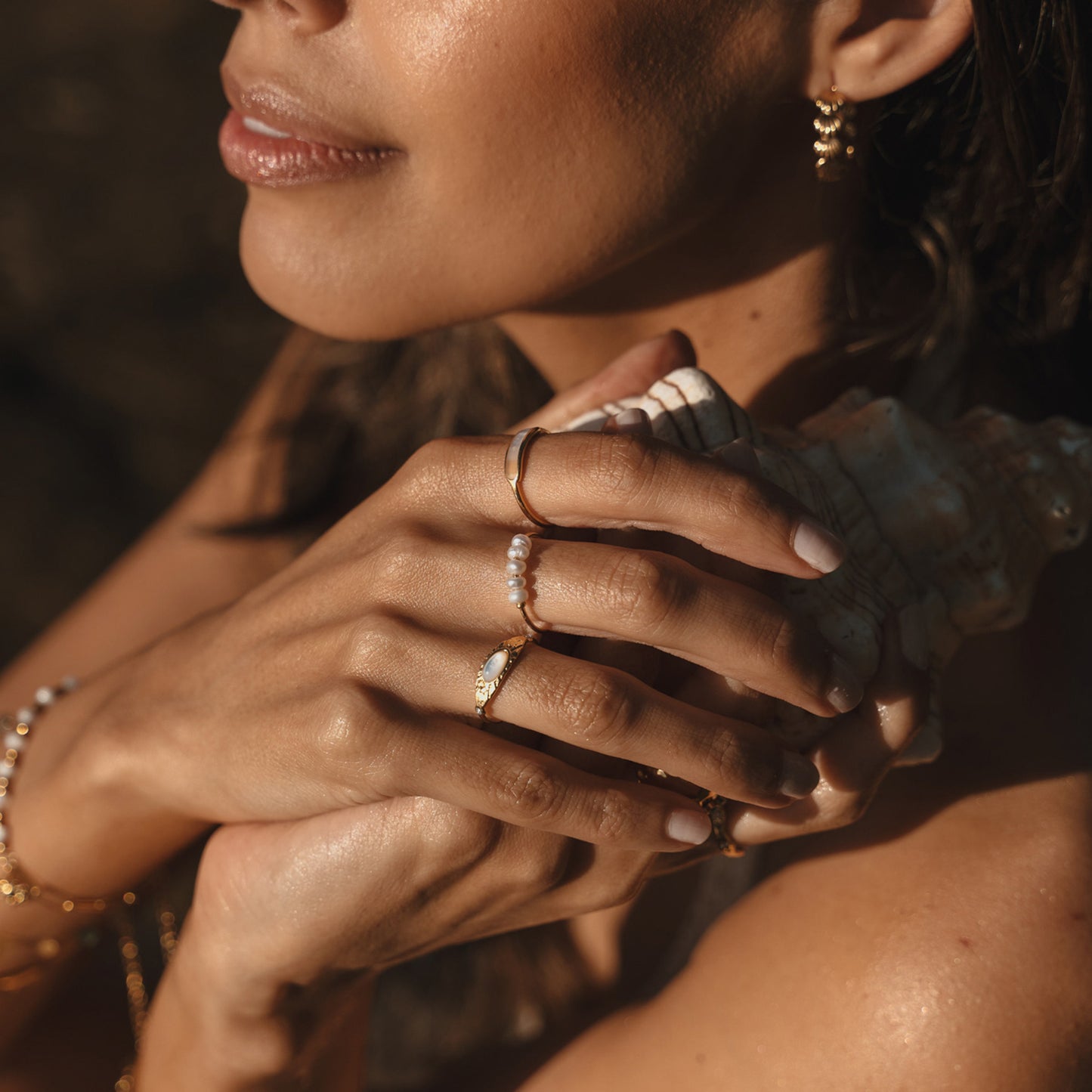 Multiple rings. Australian jewellery. Stainless steel rings with PVD 18k. Shell rings and freshwater pearl rings. Waterproof jewellery Australia