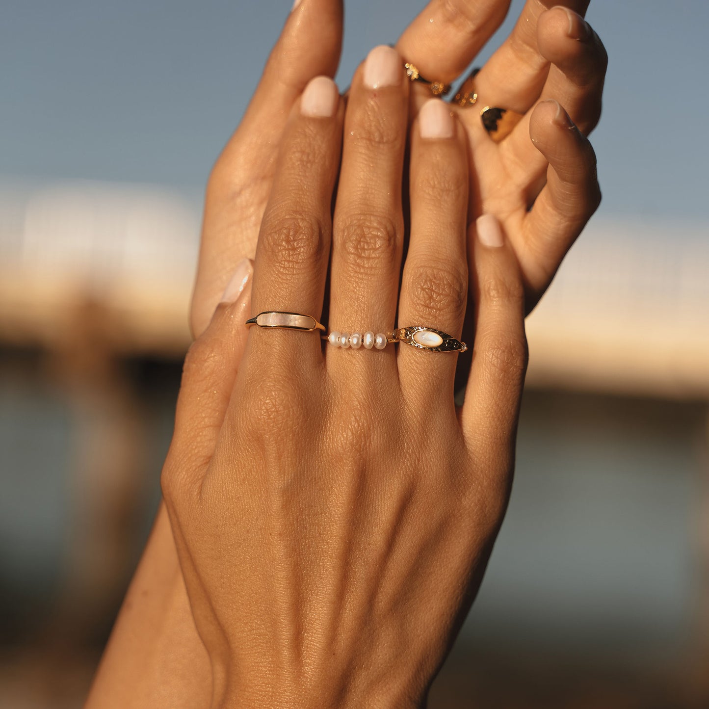 Multiple rings. Australian jewellery. Stainless steel rings with PVD 18k. Shell rings and freshwater pearl rings. Waterproof jewellery Australia