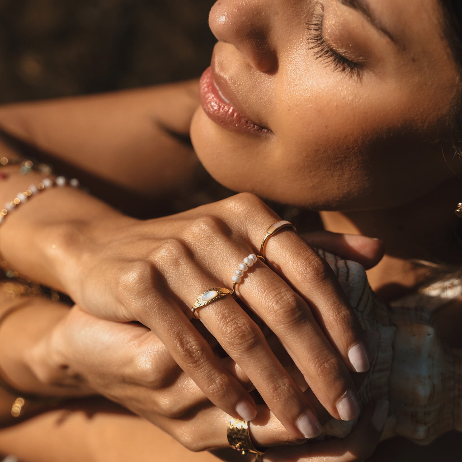 Multiple rings. Australian jewellery. Stainless steel rings with PVD 18k. Shell rings and freshwater pearl rings. Waterproof jewellery Australia