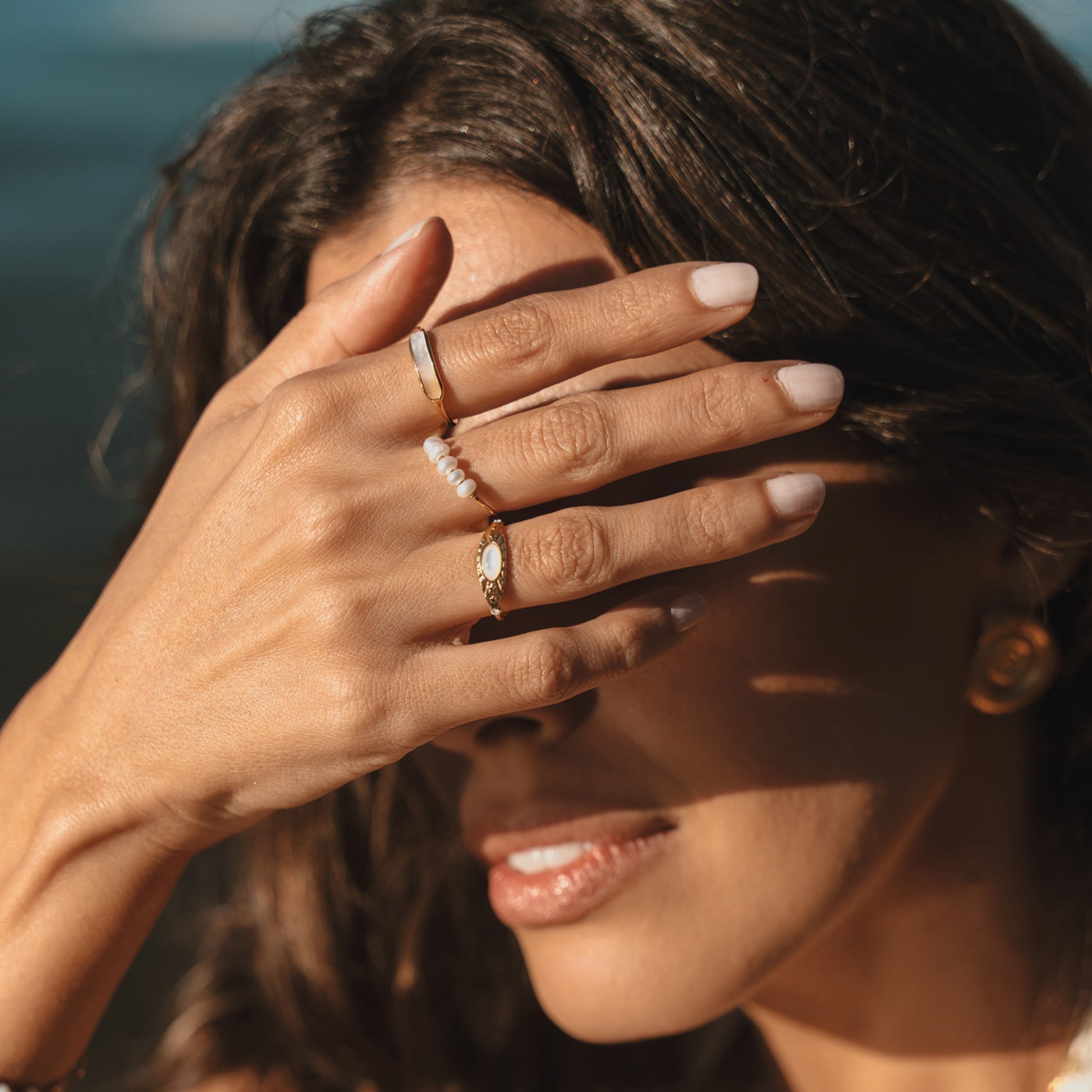 Multiple rings. Australian jewellery. Stainless steel rings with PVD 18k. Shell rings and freshwater pearl rings. Waterproof jewellery Australia